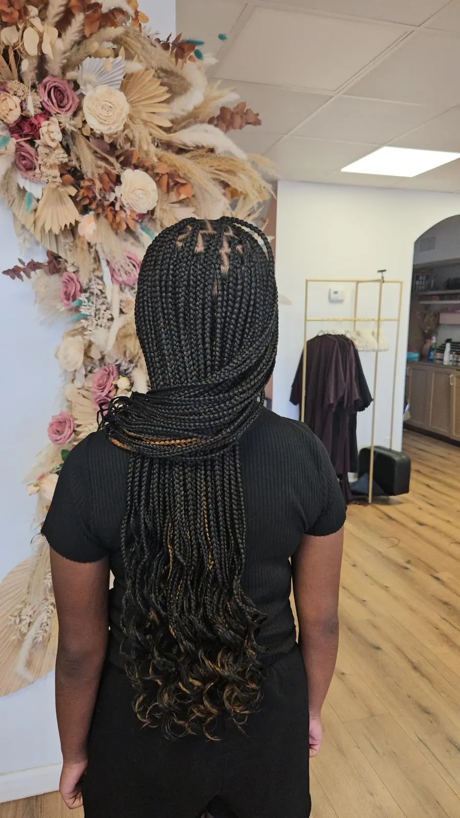 Finished long box braids photographed in the salon by Empress Royal Braids & Beauty